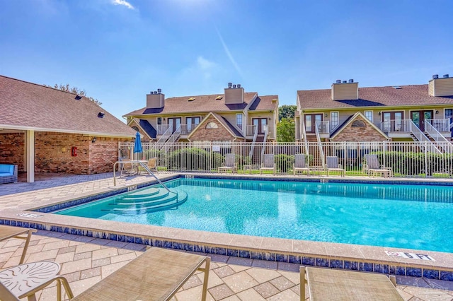 view of swimming pool featuring a patio