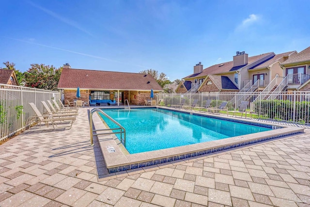 view of pool featuring a patio area