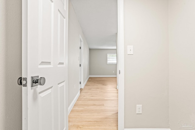 hall with light hardwood / wood-style flooring