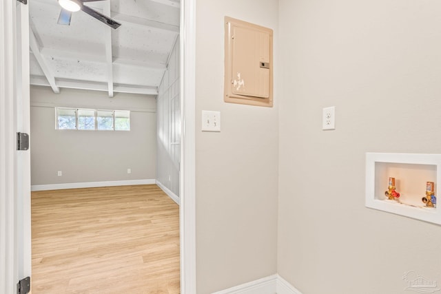 laundry area with ceiling fan, washer hookup, electric panel, and wood-type flooring