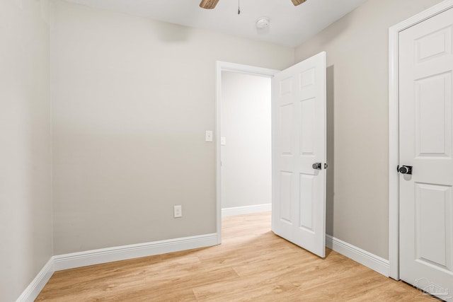 unfurnished bedroom featuring ceiling fan and light hardwood / wood-style flooring