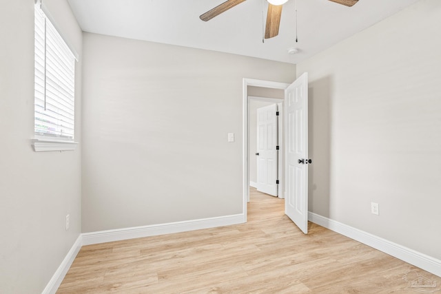 unfurnished room featuring ceiling fan and light wood-type flooring