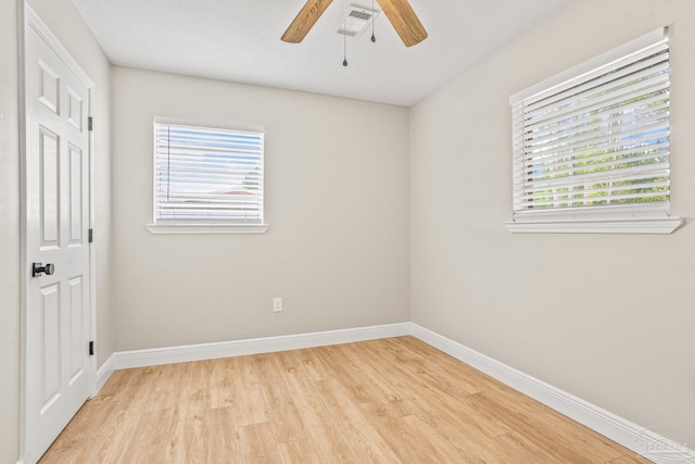 spare room with ceiling fan and light hardwood / wood-style flooring