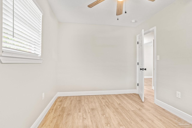 empty room featuring ceiling fan and light wood-type flooring