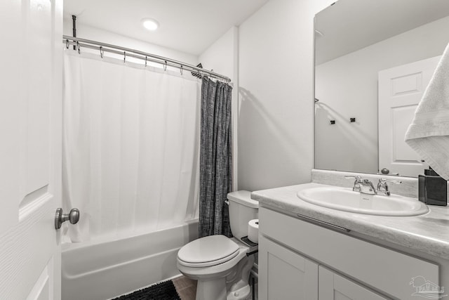 full bathroom with vanity, toilet, and shower / bath combo with shower curtain