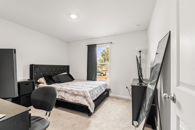 bedroom with light carpet