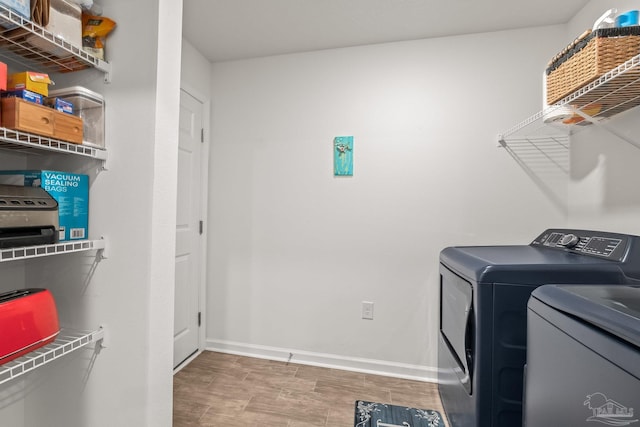 washroom featuring independent washer and dryer