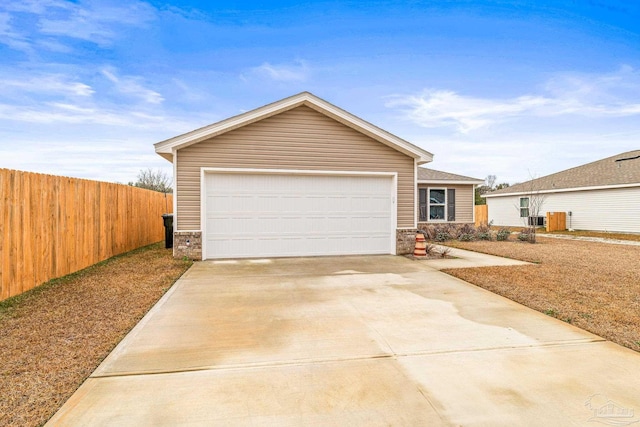 ranch-style house with central AC and a garage