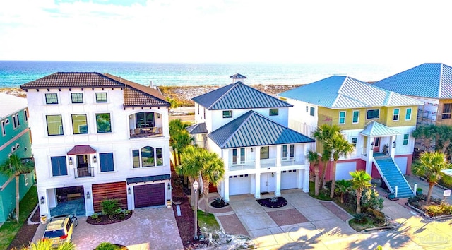 view of front of house with a water view