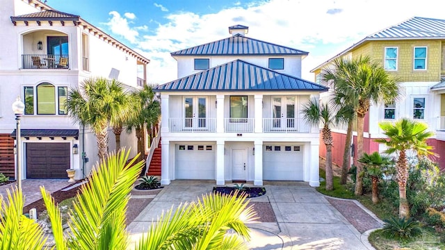 view of front of house with a balcony and a garage