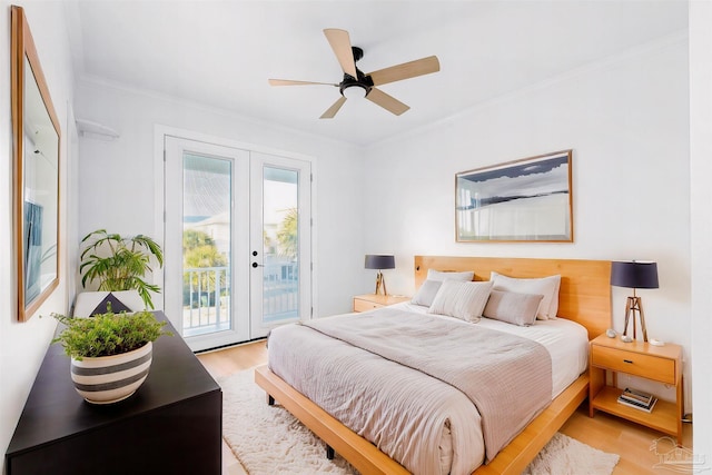 bedroom with ornamental molding, access to exterior, ceiling fan, light wood-type flooring, and french doors