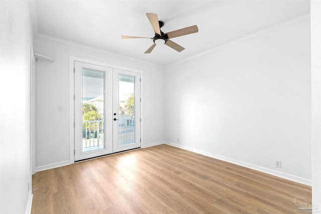 spare room featuring crown molding, light hardwood / wood-style floors, french doors, and ceiling fan