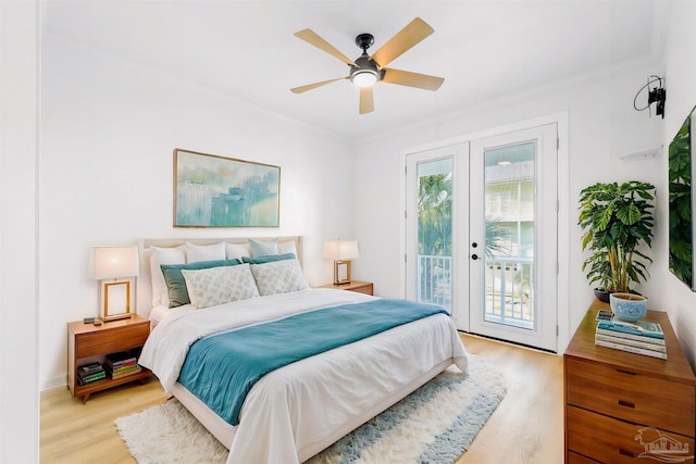 bedroom with crown molding, ceiling fan, access to exterior, light hardwood / wood-style floors, and french doors