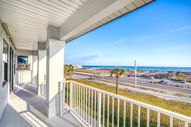 balcony featuring a water view