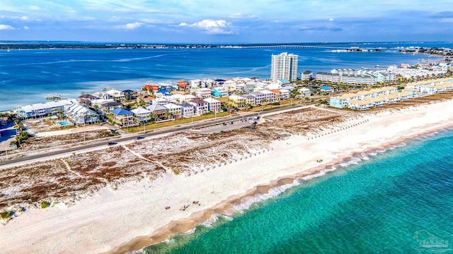 aerial view with a water view and a view of the beach