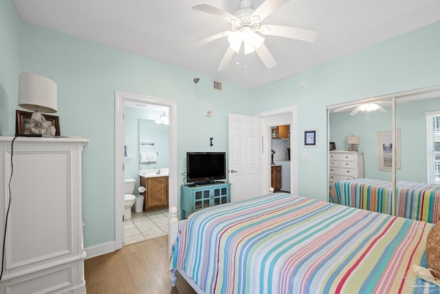 850 Ft Pickens Rd Unit 1230, Pensacola Beach, FL 32561 - bedroom featuring light wood-style floors, a closet, ceiling fan, and ensuite bath