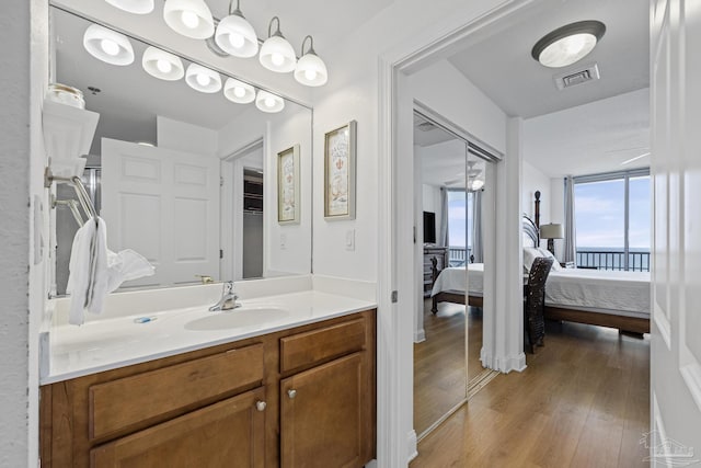 850 Ft Pickens Rd Unit 1230, Pensacola Beach, FL 32561 - ensuite bathroom with vanity and wood finished floors