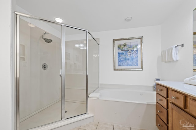 850 Ft Pickens Rd Unit 1230, Pensacola Beach, FL 32561 - full bathroom with a stall shower, a garden tub, vanity, and tile patterned flooring