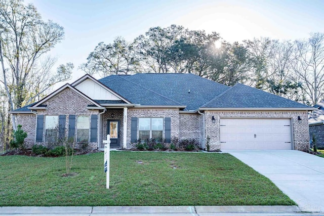 ranch-style house featuring brick siding, a front yard, roof with shingles, driveway, and an attached garage