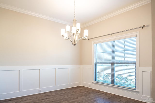 unfurnished room with dark wood-type flooring, a decorative wall, crown molding, and a wainscoted wall