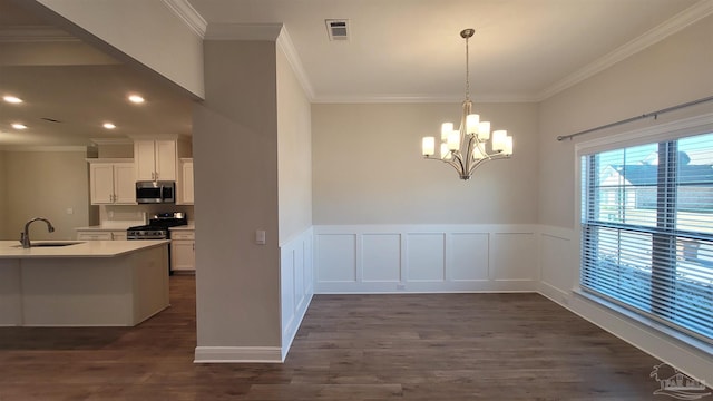 unfurnished dining area with a sink, dark wood-style flooring, and crown molding