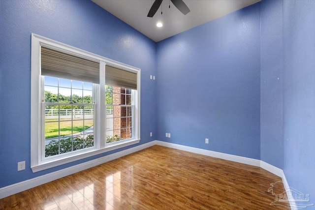 unfurnished room featuring a ceiling fan, recessed lighting, baseboards, and wood finished floors