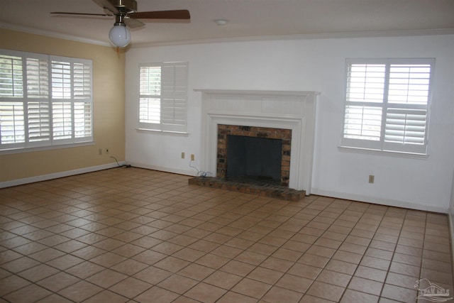 unfurnished living room featuring crown molding, light tile patterned floors, ceiling fan, and a fireplace