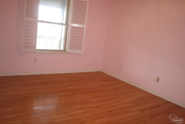 unfurnished room featuring wood-type flooring