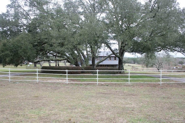 view of yard with a rural view