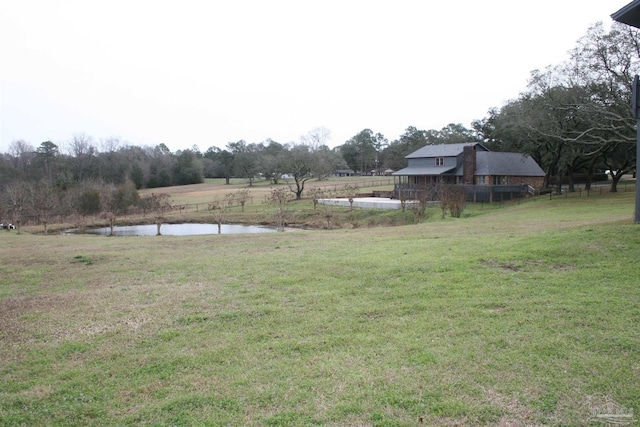 view of yard featuring a water view and a rural view