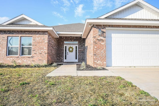 view of front of house with a front yard and a garage