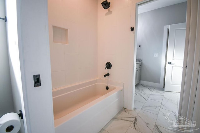 bathroom featuring vanity and tiled shower / bath combo