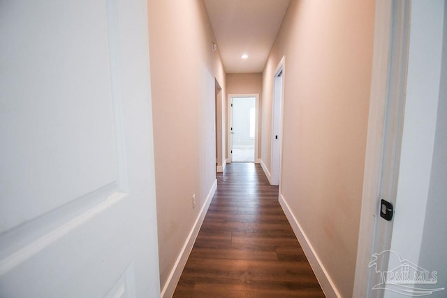 corridor with dark hardwood / wood-style floors