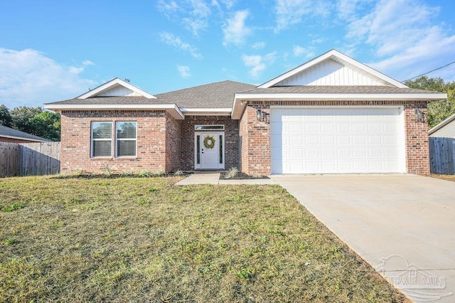 ranch-style house featuring a garage and a front lawn