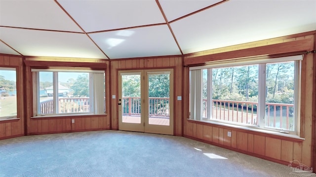 unfurnished sunroom featuring plenty of natural light and lofted ceiling