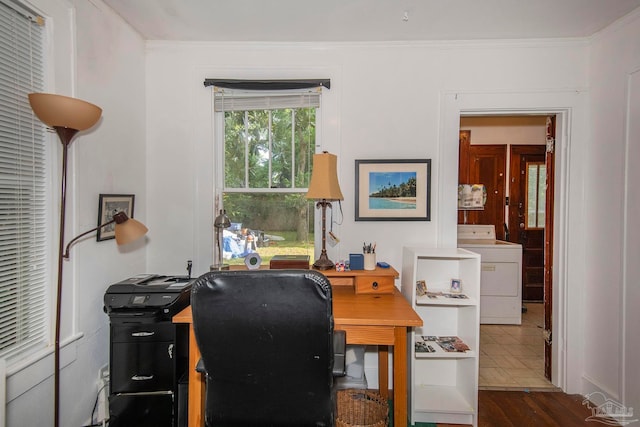 office area with crown molding, washer / dryer, and wood-type flooring