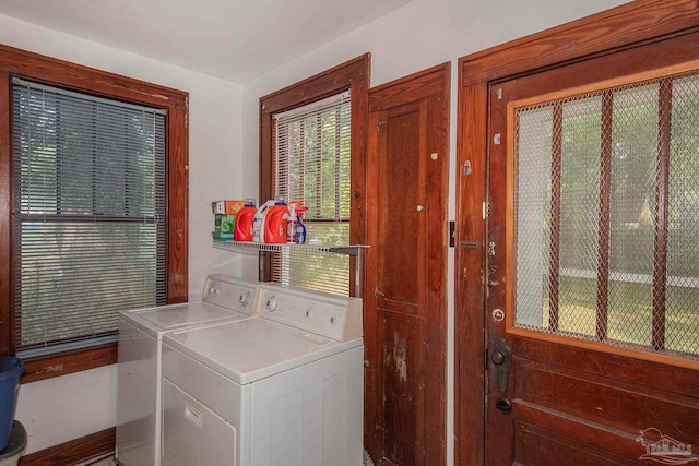 laundry room with washing machine and clothes dryer