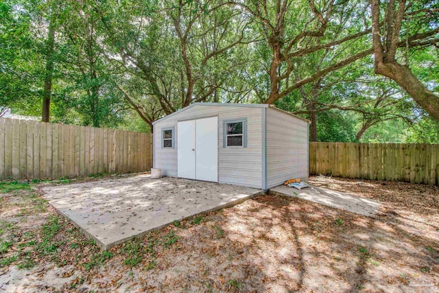 view of shed featuring a fenced backyard