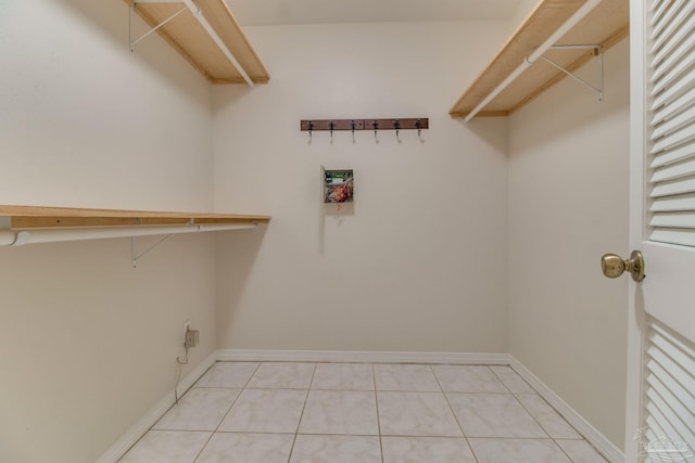 spacious closet featuring light tile patterned flooring