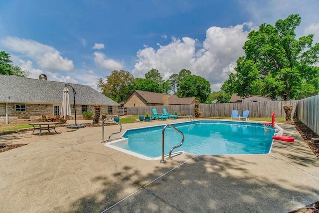 view of pool featuring a fenced backyard, a patio, and a fenced in pool