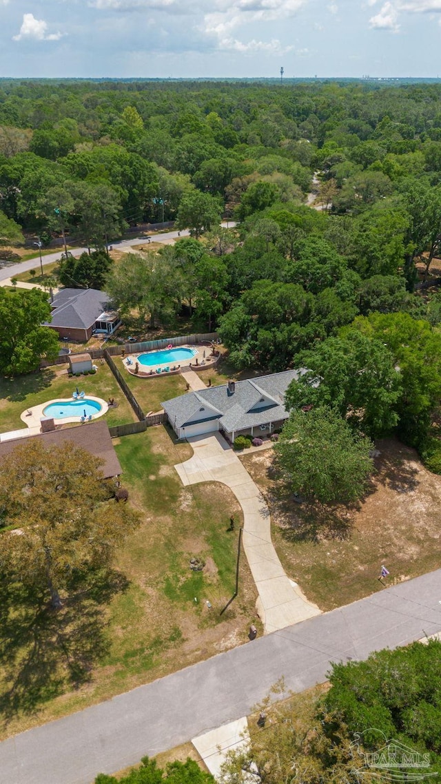 bird's eye view featuring a view of trees