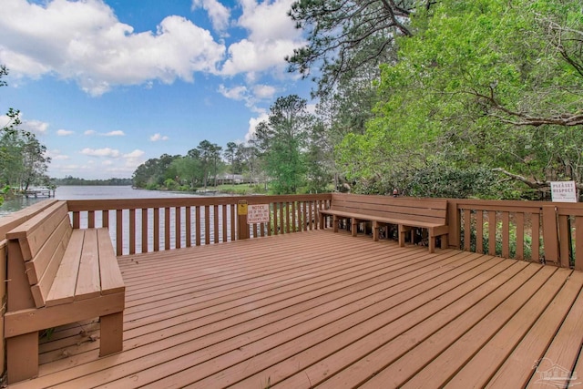 wooden deck with a water view