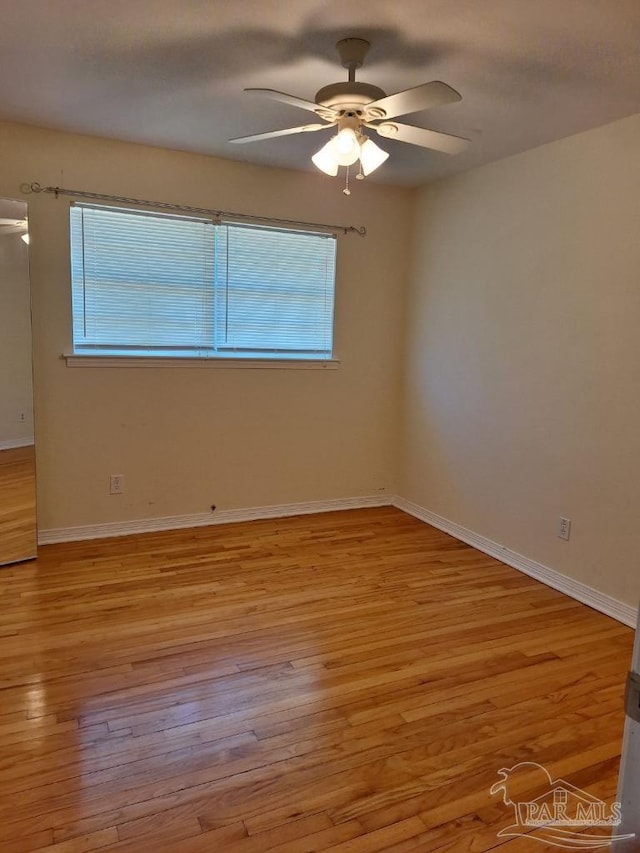 unfurnished room featuring ceiling fan and light wood-type flooring