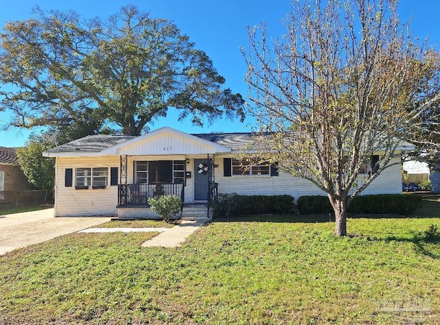 ranch-style house with a porch and a front yard