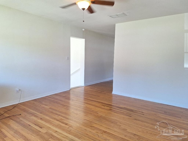 unfurnished room with ceiling fan and light hardwood / wood-style flooring