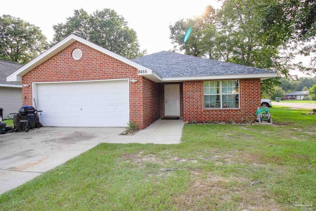 ranch-style home featuring a garage and a front yard