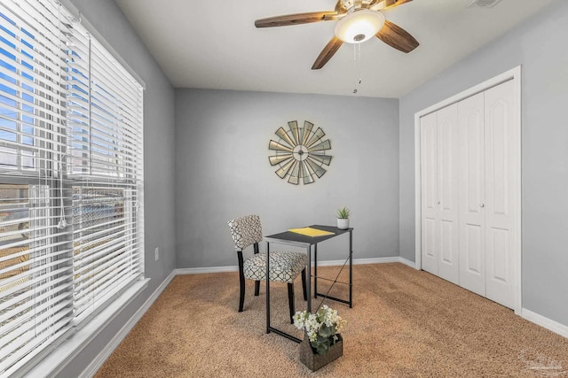 office with ceiling fan and light colored carpet