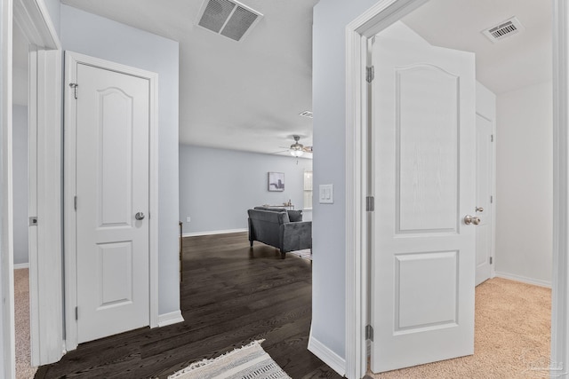 hallway featuring dark hardwood / wood-style flooring