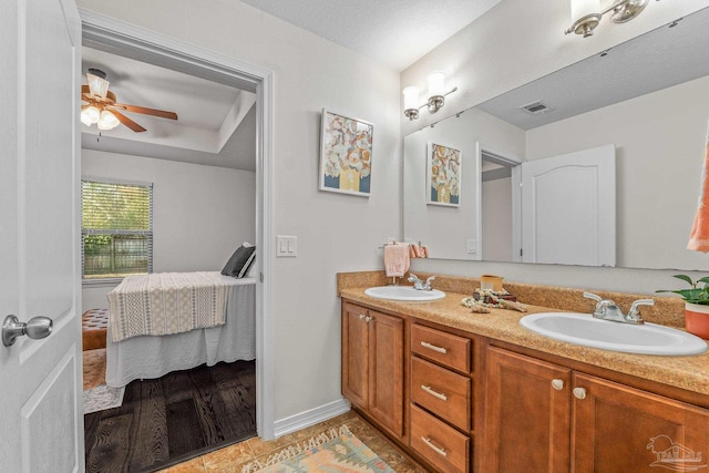 bathroom with vanity and ceiling fan