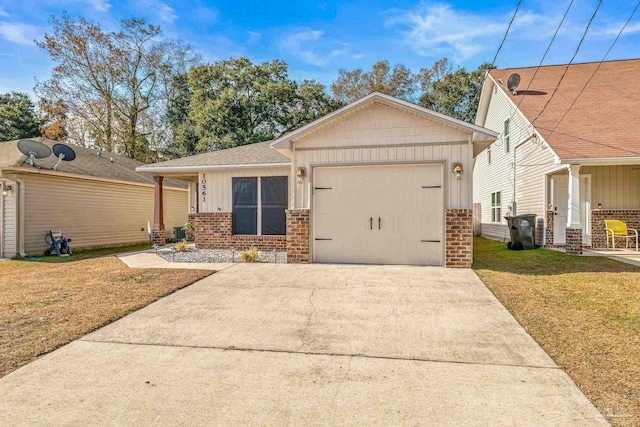 view of front of property with a garage and a front yard